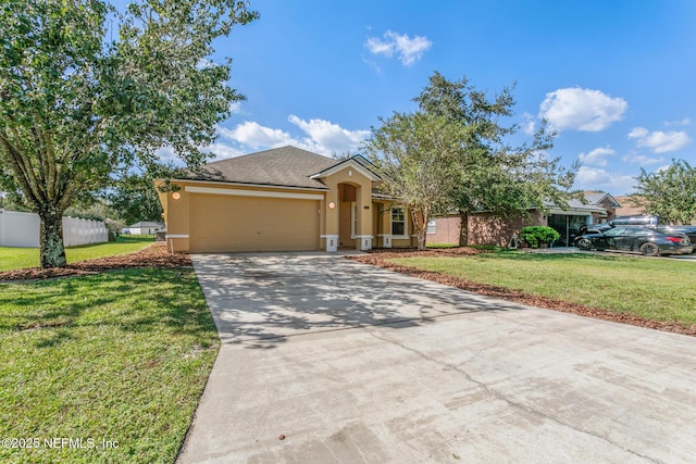 single story home with driveway, stucco siding, an attached garage, fence, and a front yard