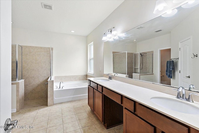 bathroom with tile patterned flooring, separate shower and tub, a chandelier, and vanity