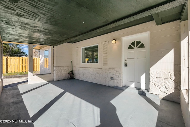 entrance to property featuring a patio