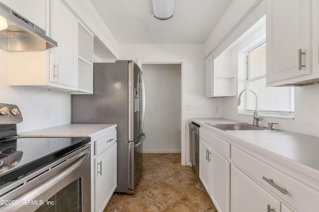 kitchen with white cabinetry, stainless steel appliances, and sink