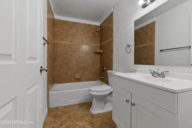 full bathroom featuring toilet, tiled shower / bath, a textured ceiling, vanity, and tile patterned flooring