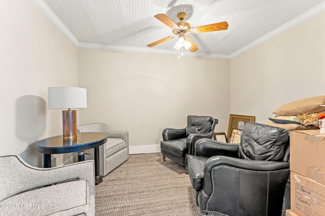 carpeted living room with ornamental molding and ceiling fan