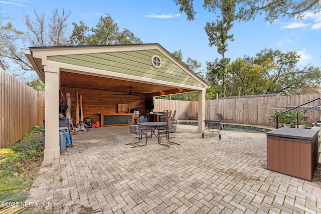 view of patio featuring a fenced in pool and a gazebo