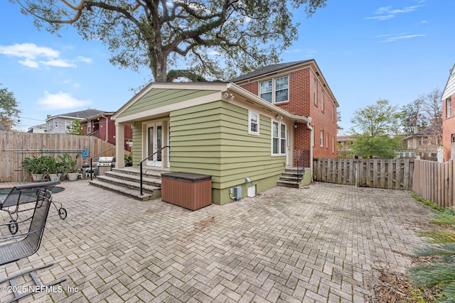 back of house with a patio