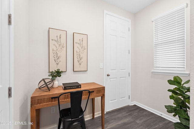 office with dark hardwood / wood-style flooring