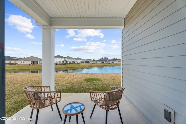 view of patio with a water view