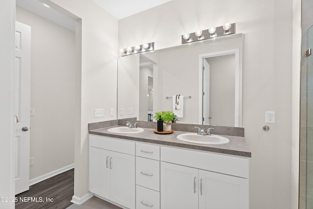 bathroom with vanity and hardwood / wood-style floors