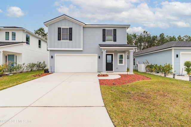 view of front of home featuring a front yard and a garage