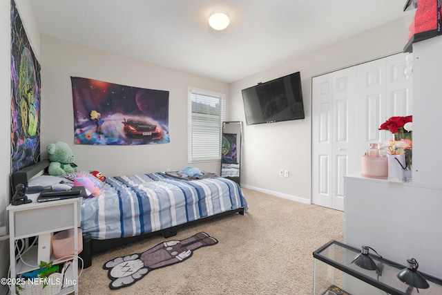 carpeted bedroom with a closet