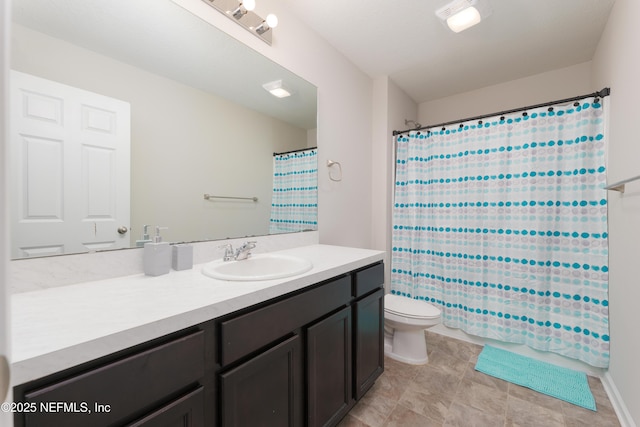 bathroom with toilet and vanity