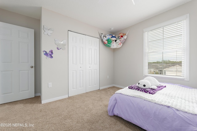 carpeted bedroom with a closet