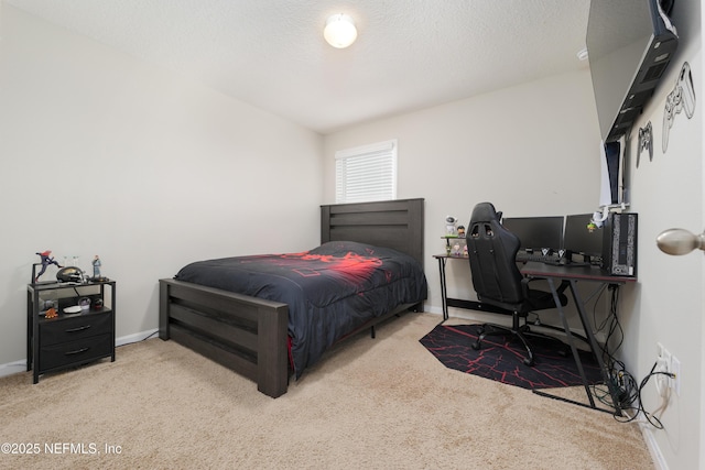 carpeted bedroom featuring a textured ceiling