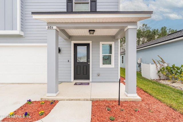 doorway to property featuring a garage