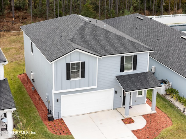 view of front of house with a front yard and a garage