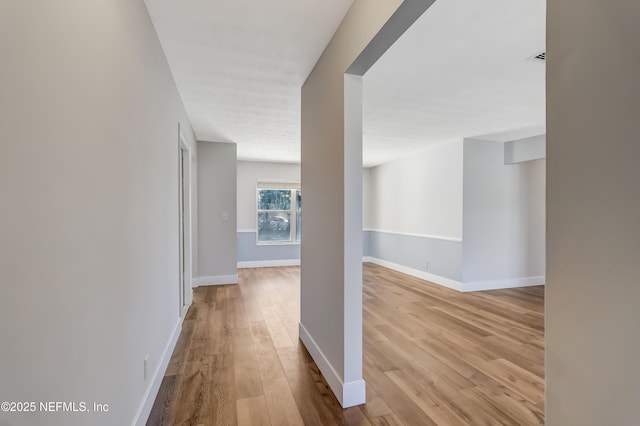 hall with light hardwood / wood-style flooring