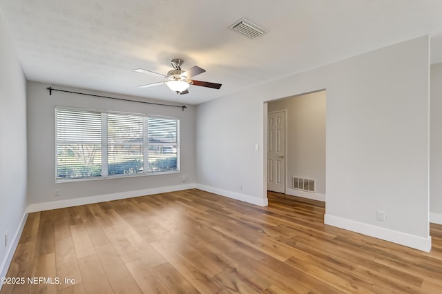 unfurnished room featuring ceiling fan and light hardwood / wood-style floors