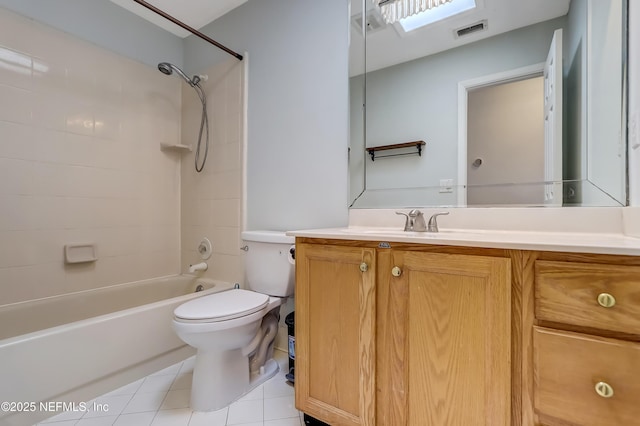 full bathroom featuring toilet, vanity, tile patterned floors, shower / washtub combination, and a skylight