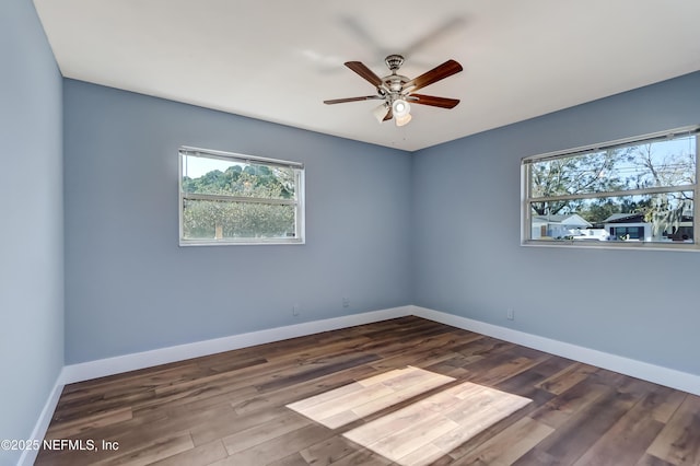 empty room with ceiling fan and wood-type flooring