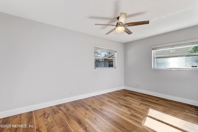 unfurnished room featuring ceiling fan and wood-type flooring