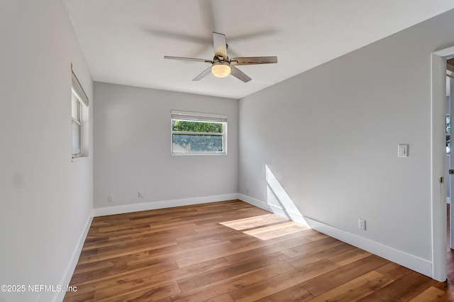 spare room featuring ceiling fan and hardwood / wood-style floors