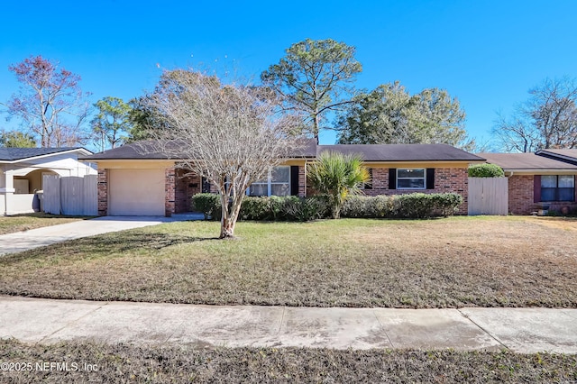 single story home featuring a front lawn and a garage