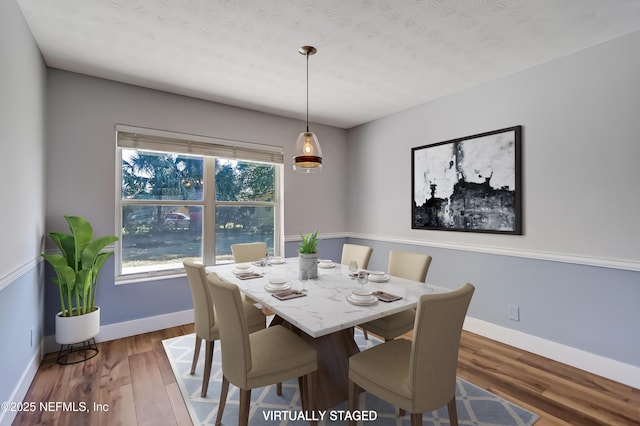 dining room with hardwood / wood-style floors