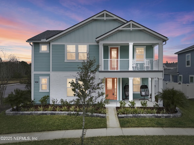 view of front of home with a porch and a balcony