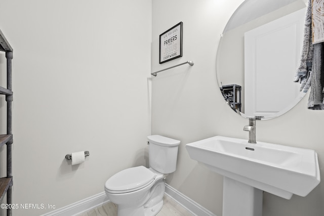 bathroom with sink and toilet