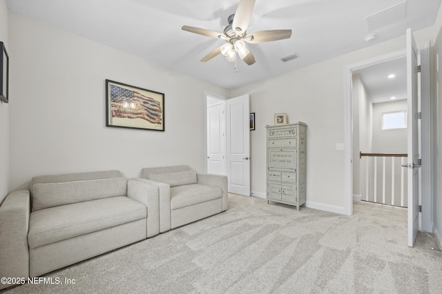 carpeted living room featuring ceiling fan