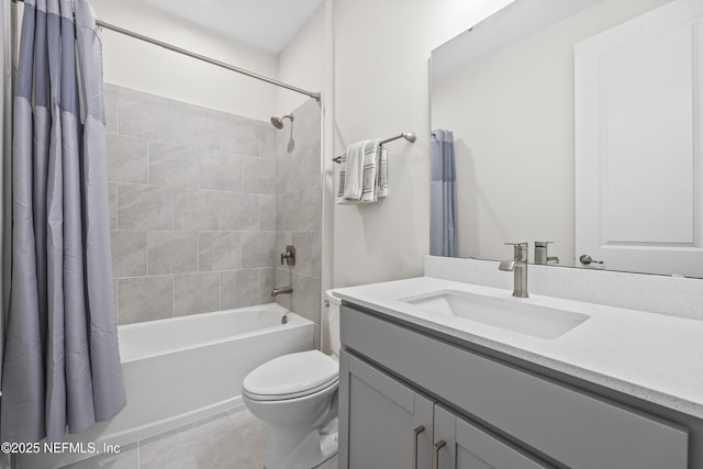 full bathroom with shower / bath combo with shower curtain, tile patterned floors, toilet, and vanity