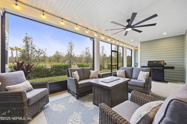 exterior space with ceiling fan and rail lighting