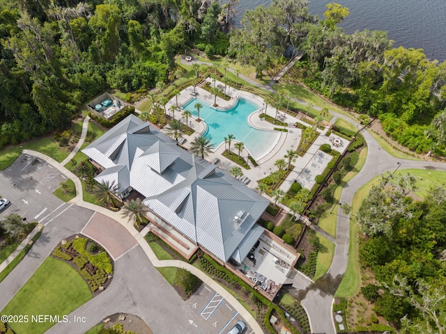 birds eye view of property with a water view