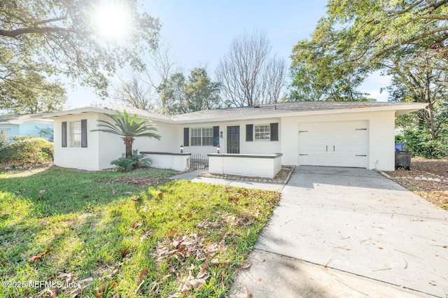 ranch-style house with a garage and a front yard