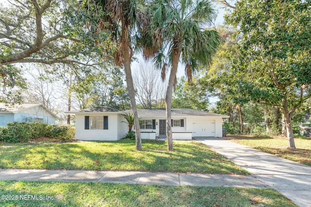 ranch-style home with a front lawn and a garage