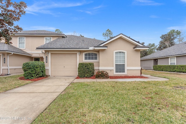 view of front of property featuring roof with shingles, stucco siding, concrete driveway, an attached garage, and a front lawn