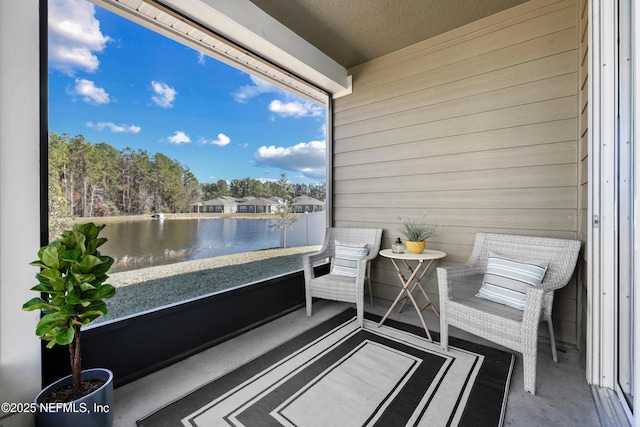 balcony featuring a water view