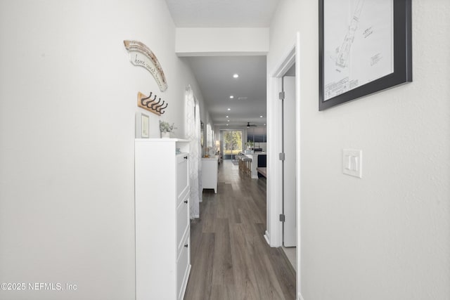 corridor with wood-type flooring