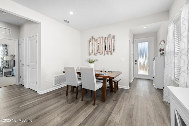 dining area featuring wood-type flooring