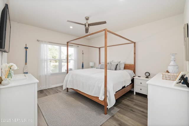 bedroom featuring ceiling fan and dark hardwood / wood-style floors