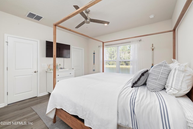 bedroom featuring ceiling fan and dark hardwood / wood-style flooring