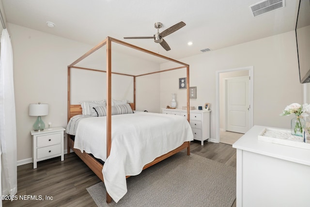 bedroom featuring ceiling fan and dark hardwood / wood-style floors