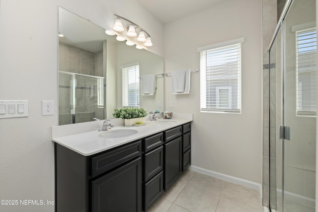 bathroom featuring an enclosed shower, vanity, and tile patterned flooring