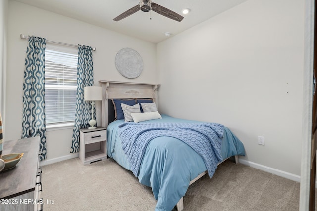 bedroom featuring ceiling fan and light colored carpet