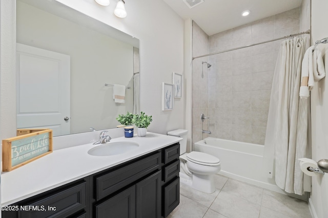 full bathroom with shower / bath combo with shower curtain, tile patterned floors, vanity, and toilet