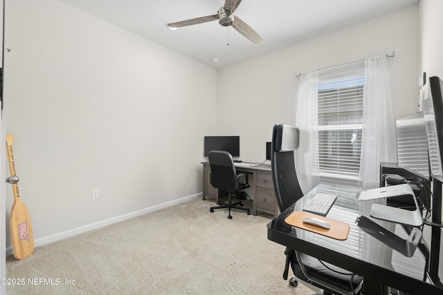 carpeted office featuring ceiling fan