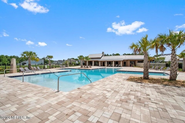 view of swimming pool featuring a patio area