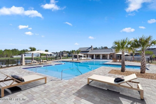 view of swimming pool with a patio area