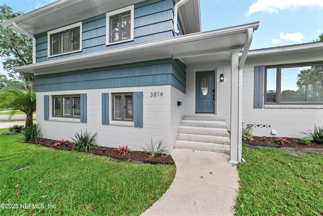 view of front of home with a front yard