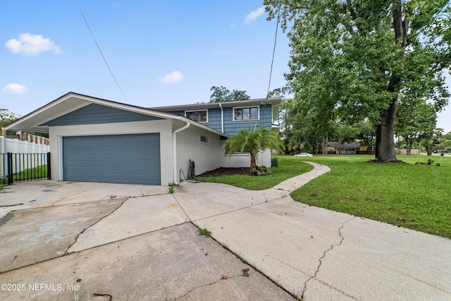 view of front of home featuring a garage and a front yard