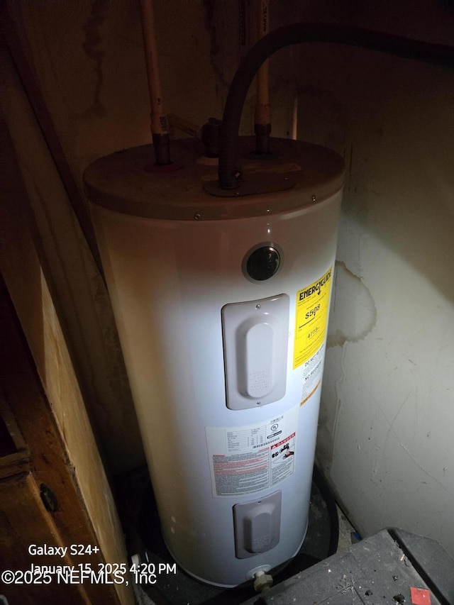 utility room with water heater